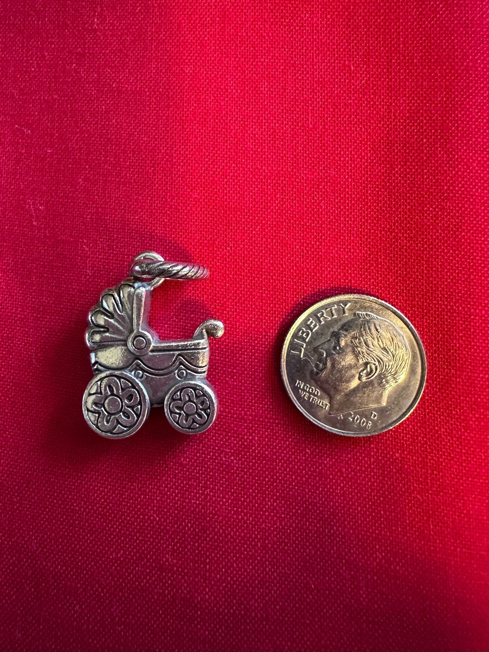 Brighton Silver Baby Carriage Charm on Red